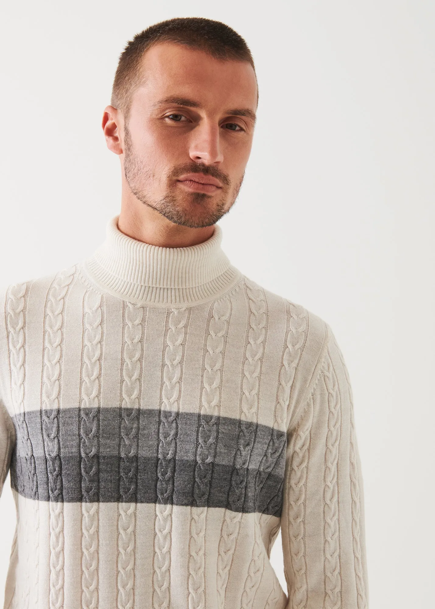 MERINO STRIPED CABLE KNIT TURTLENECK